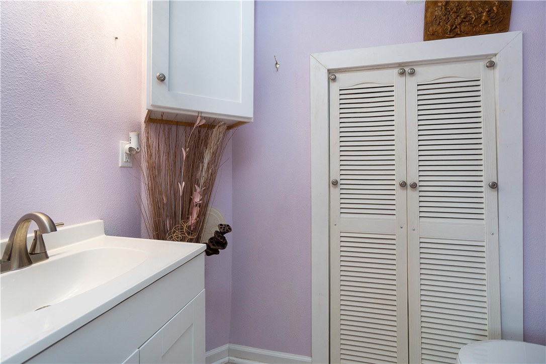 6232 Weber Road Corpus Christi, TX 78413 - Photo 12 of 23 a bathroom with a sink and a mirror