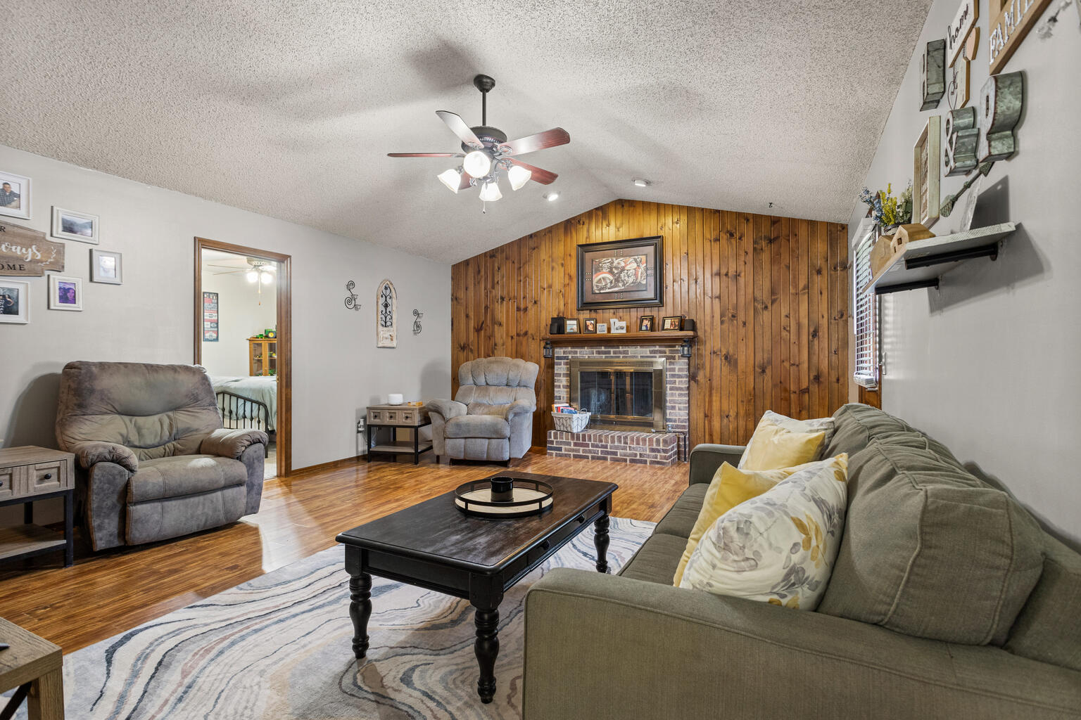 2717 East Main Street Decatur, IL 62521 - Photo 13 of 31 a living room with furniture and a fireplace