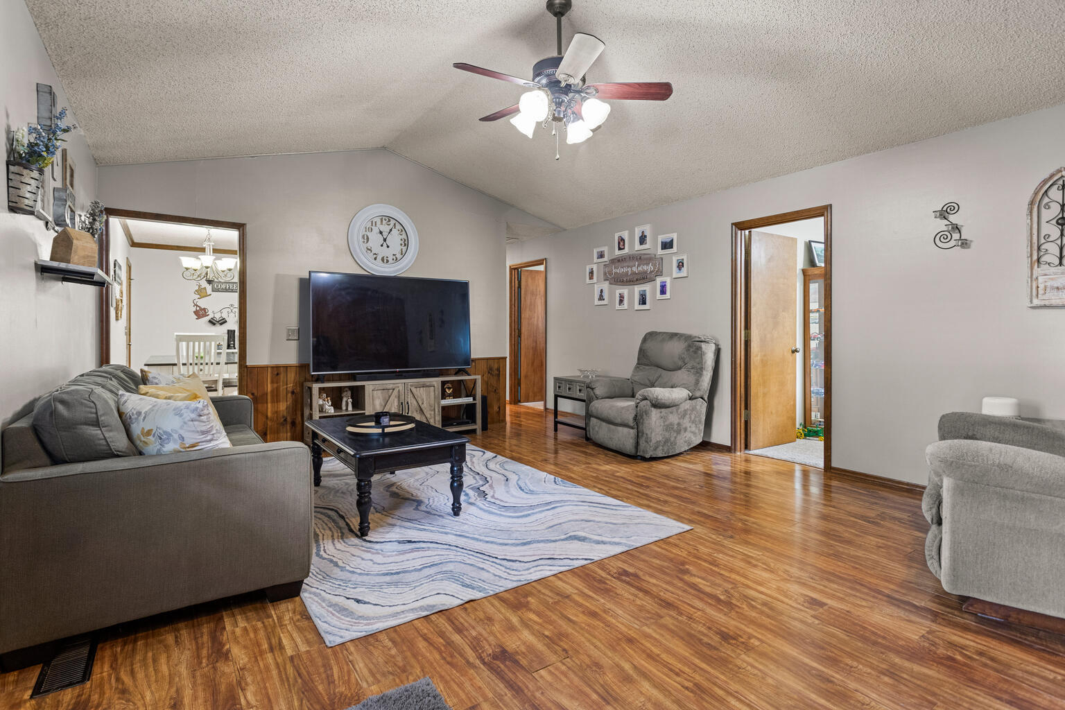 2717 East Main Street Decatur, IL 62521 - Photo 15 of 31 a living room with furniture and a flat screen tv