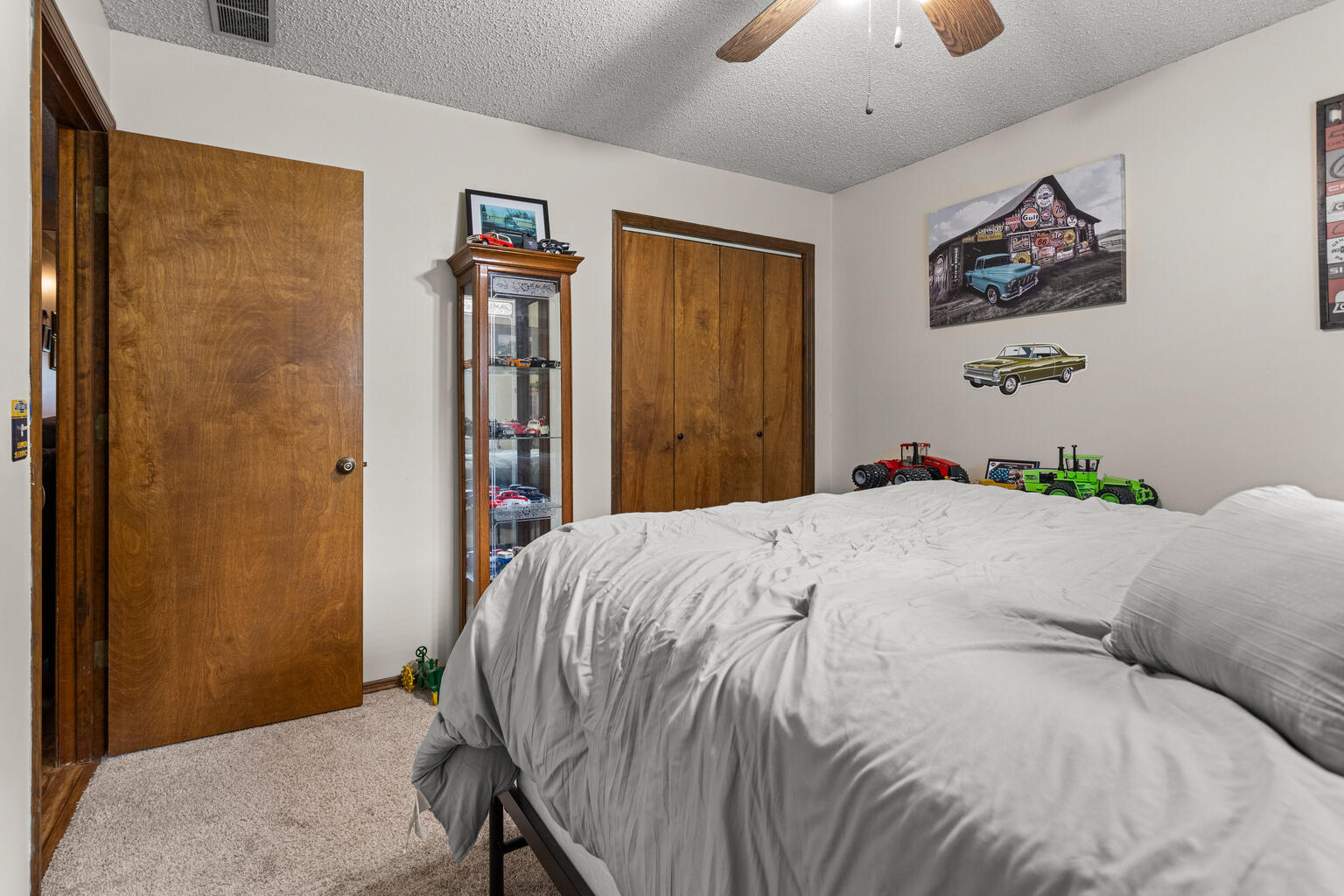 2717 East Main Street Decatur, IL 62521 - Photo 18 of 31 a bedroom with a bed and a painting on the wall
