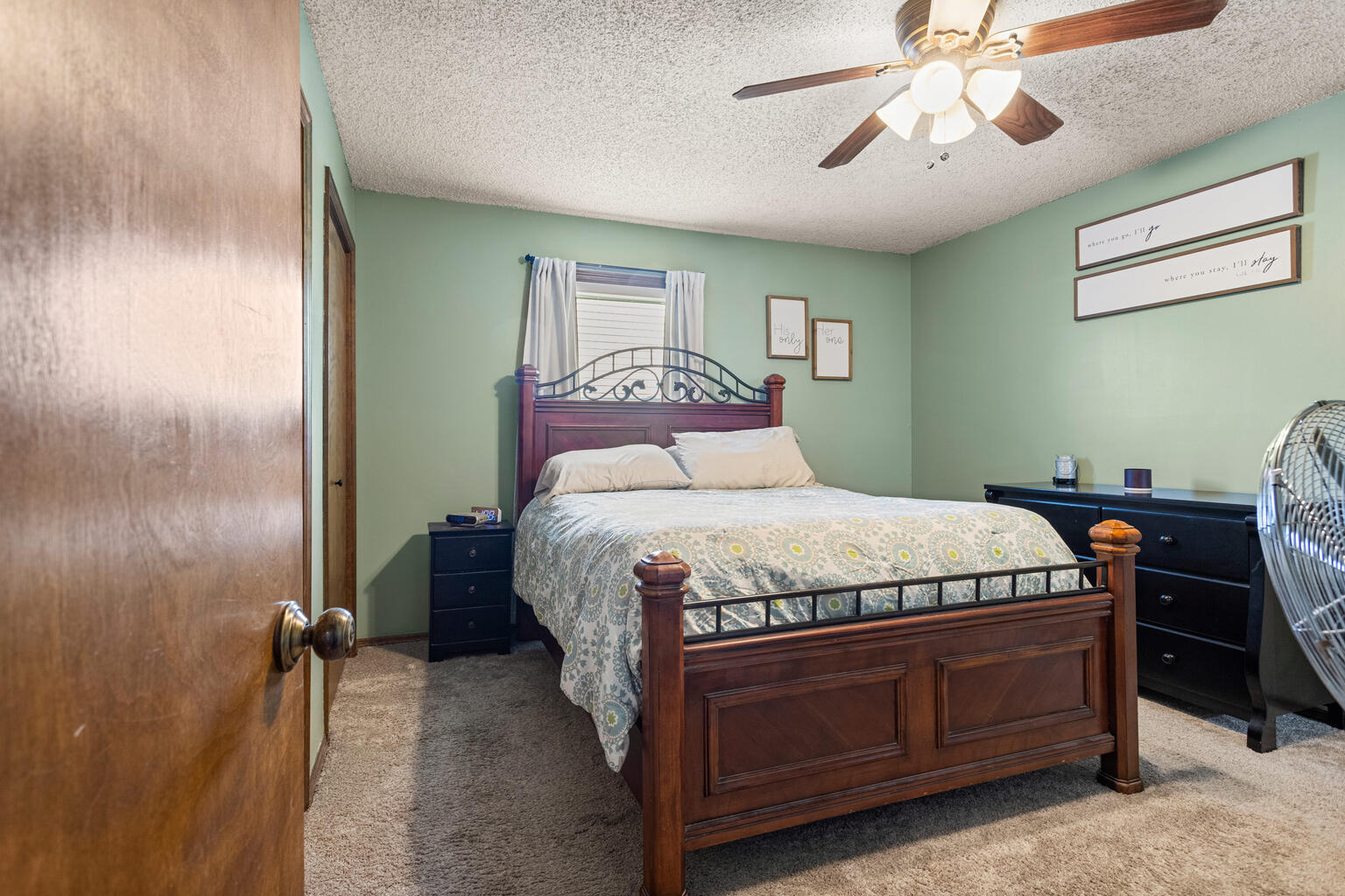 2717 East Main Street Decatur, IL 62521 - Photo 22 of 31 a bedroom with a bed and a chandelier