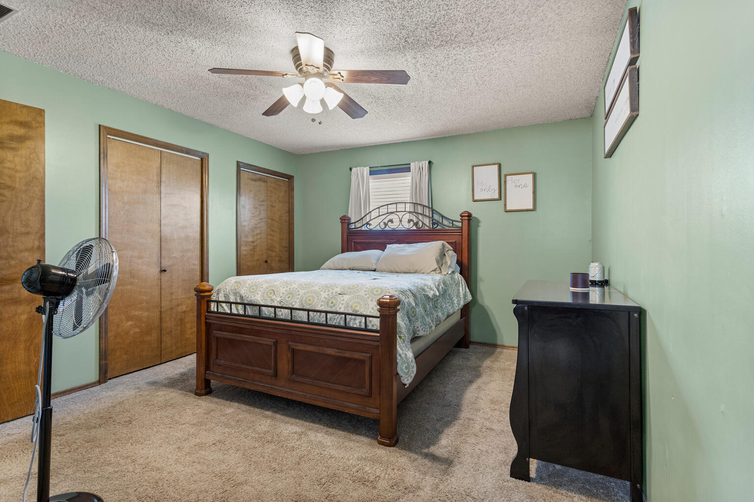 2717 East Main Street Decatur, IL 62521 - Photo 24 of 31 a bedroom with a bed and a chandelier