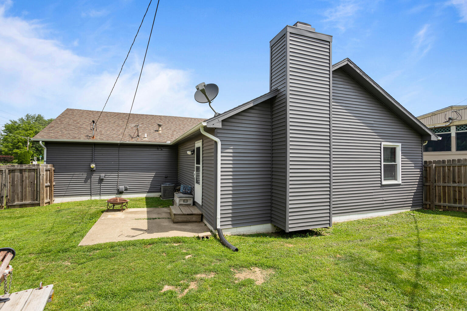 2717 East Main Street Decatur, IL 62521 - Photo 27 of 31 a view of a house with a backyard and a chair