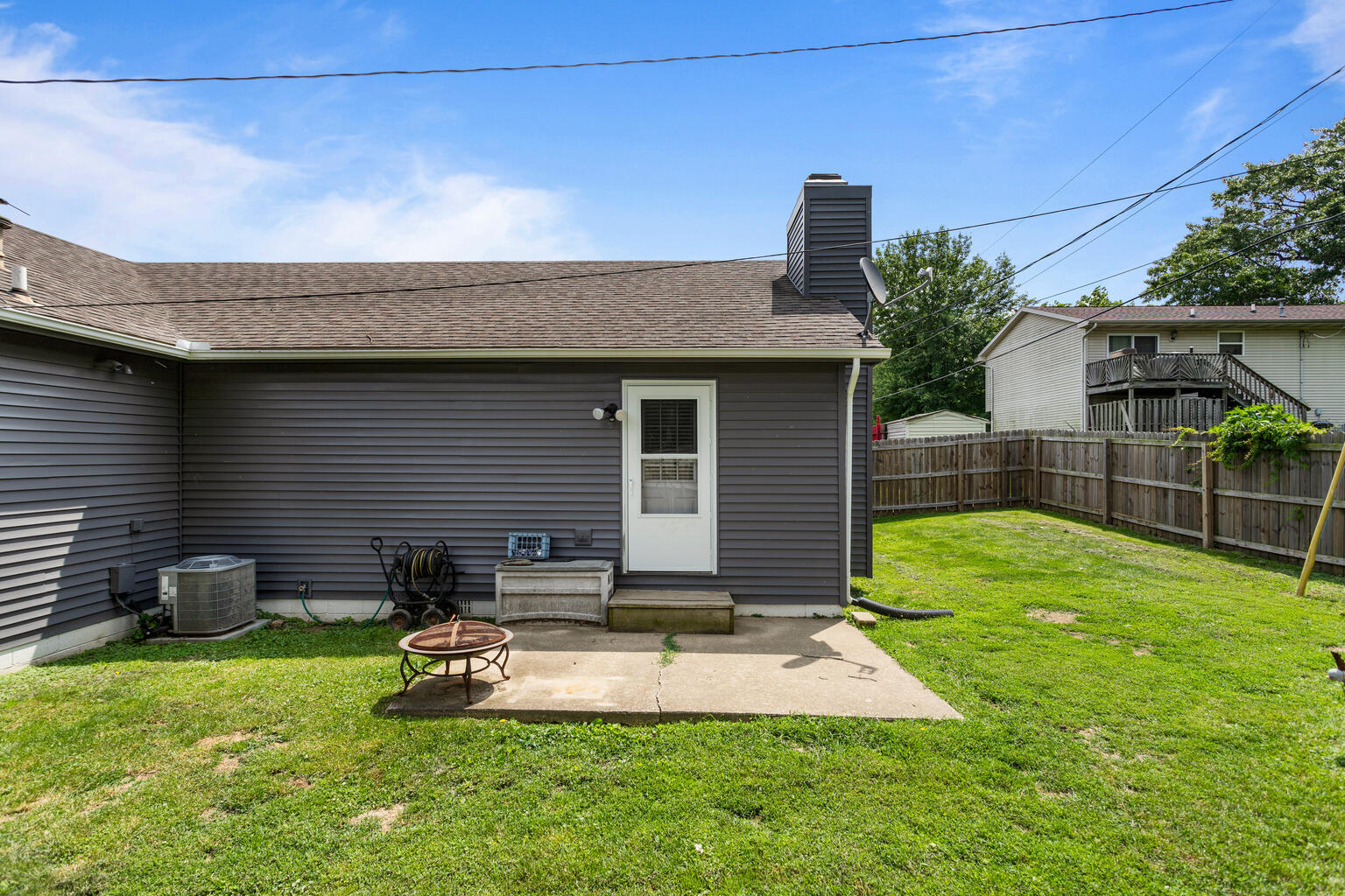 2717 East Main Street Decatur, IL 62521 - Photo 29 of 31 a view of a backyard with plants and a patio