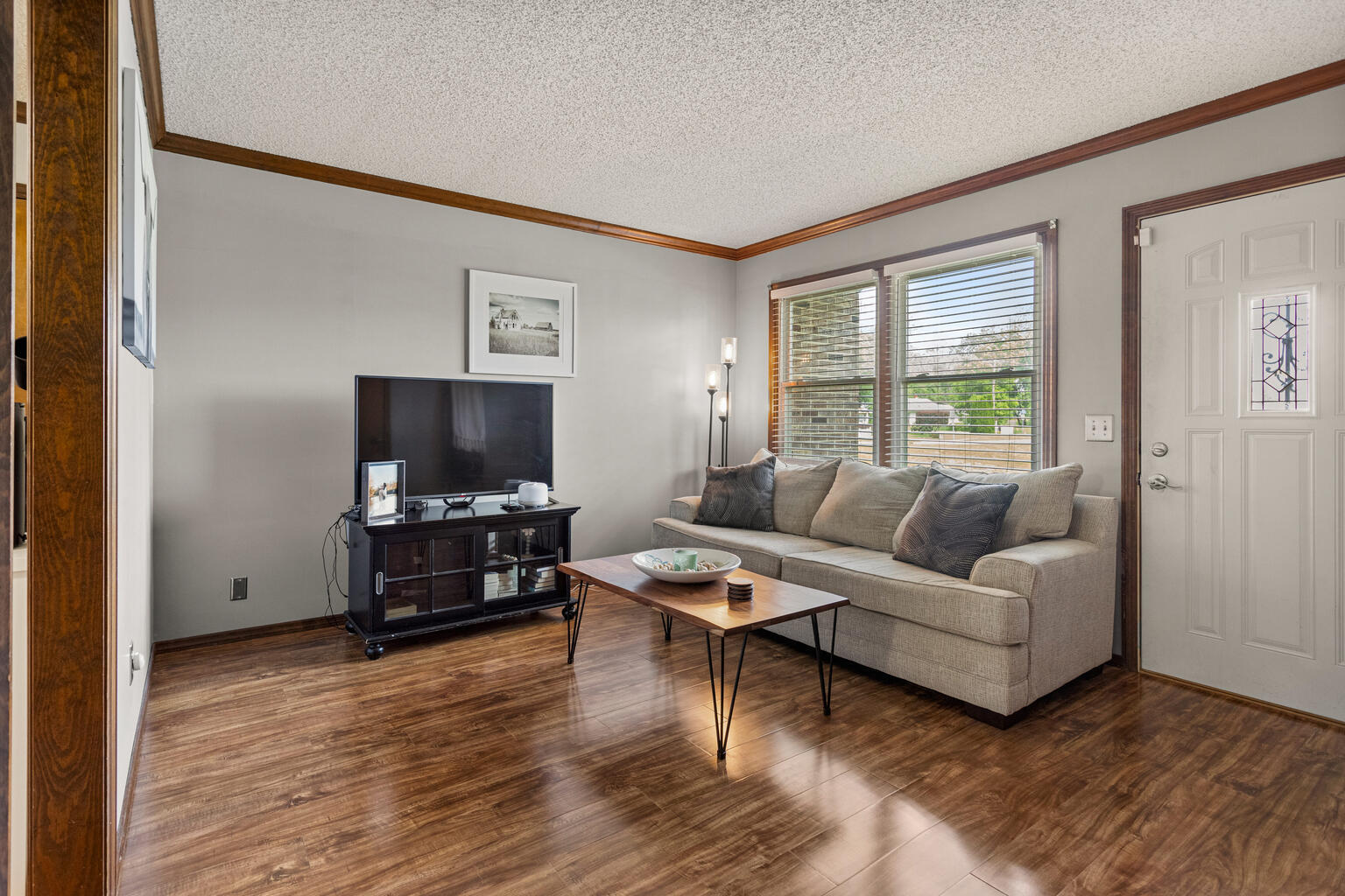 2717 East Main Street Decatur, IL 62521 - Photo 7 of 31 a living room with furniture and a flat screen tv