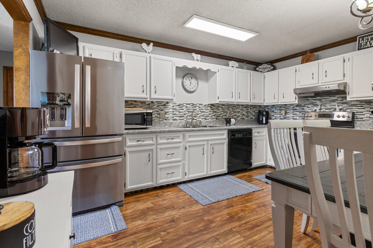 2717 East Main Street Decatur, IL 62521 - Photo 9 of 31 a kitchen with stainless steel appliances granite countertop a refrigerator a stove top oven a sink and dishwasher