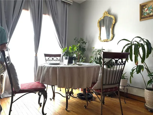 a view of balcony with furniture and wooden floor
