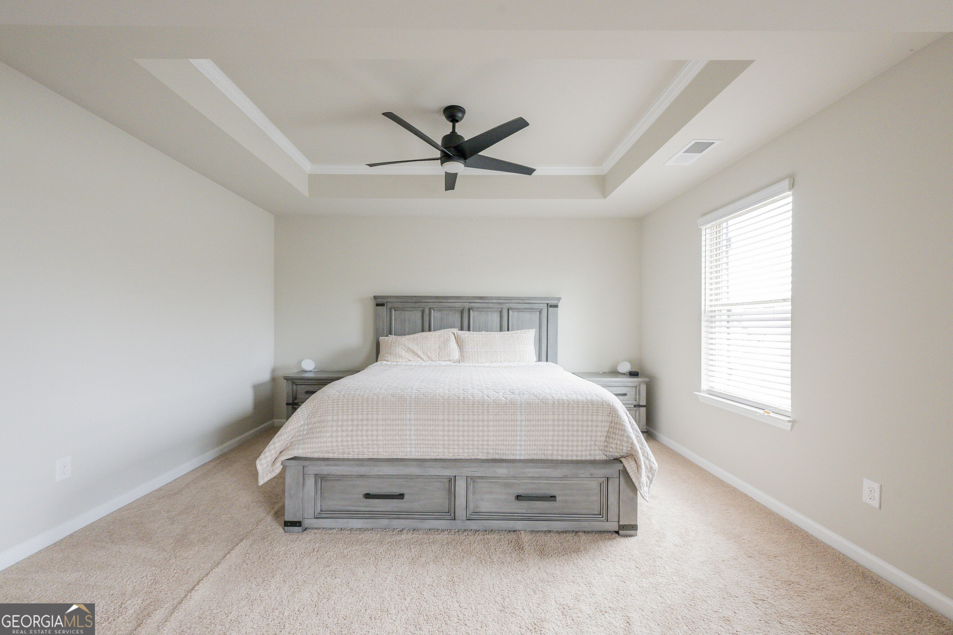 10155 Cormac Street Jonesboro, GA 30238 - Photo 21 of 40 a spacious bedroom with a bed and window