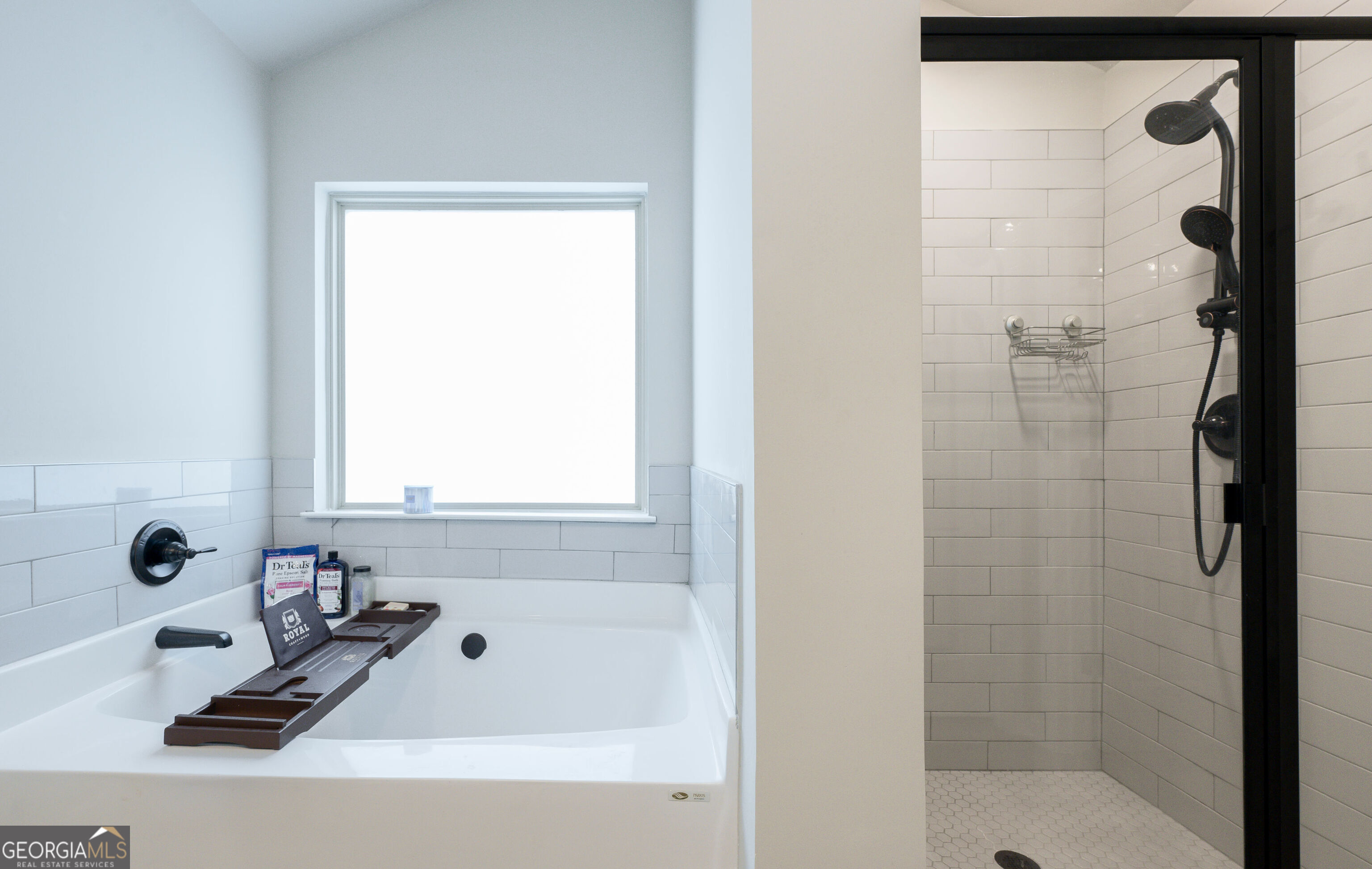 10155 Cormac Street Jonesboro, GA 30238 - Photo 28 of 40 a bathroom with a tub and a shower