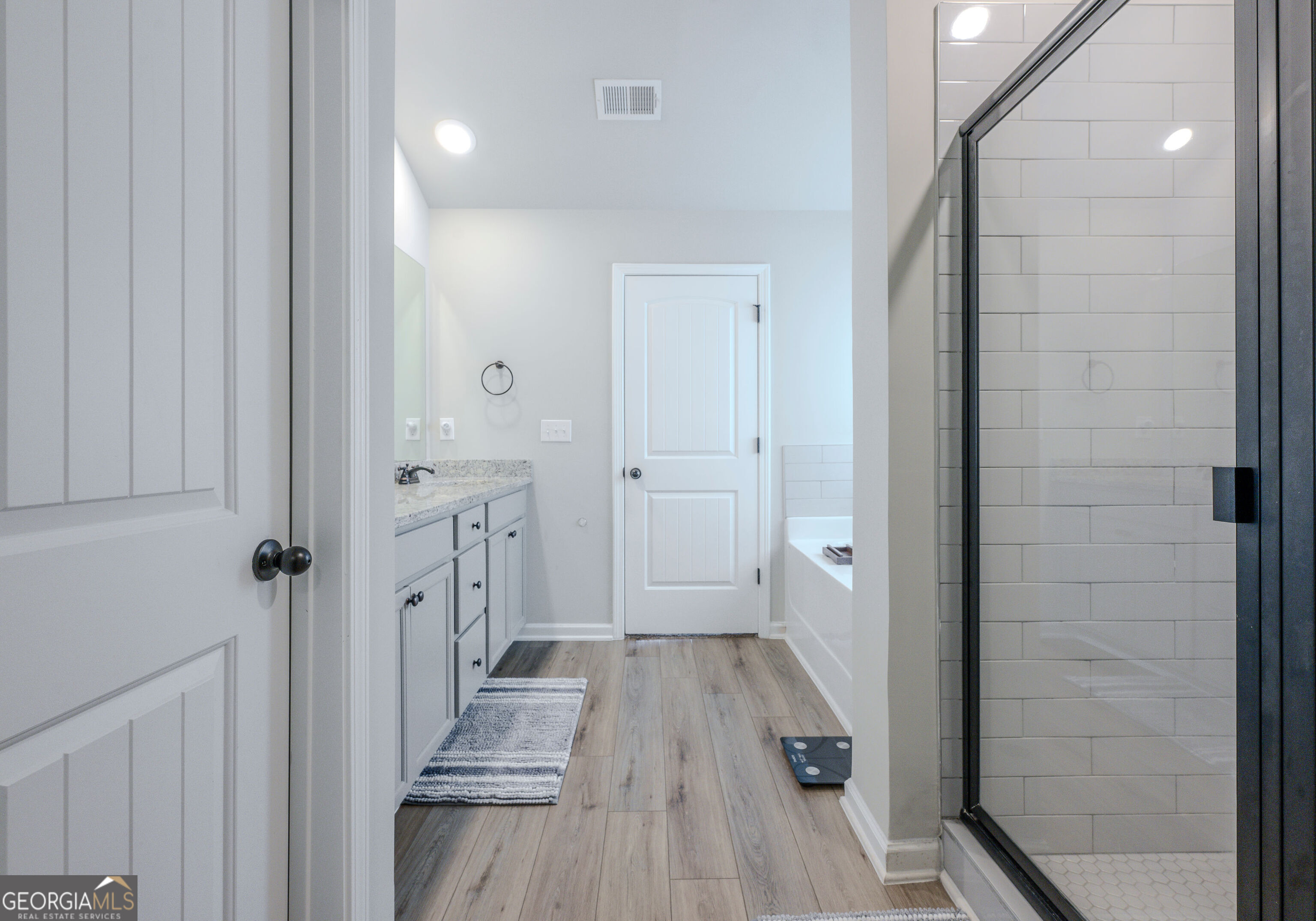 10155 Cormac Street Jonesboro, GA 30238 - Photo 29 of 40 a bathroom with a sink and a mirror