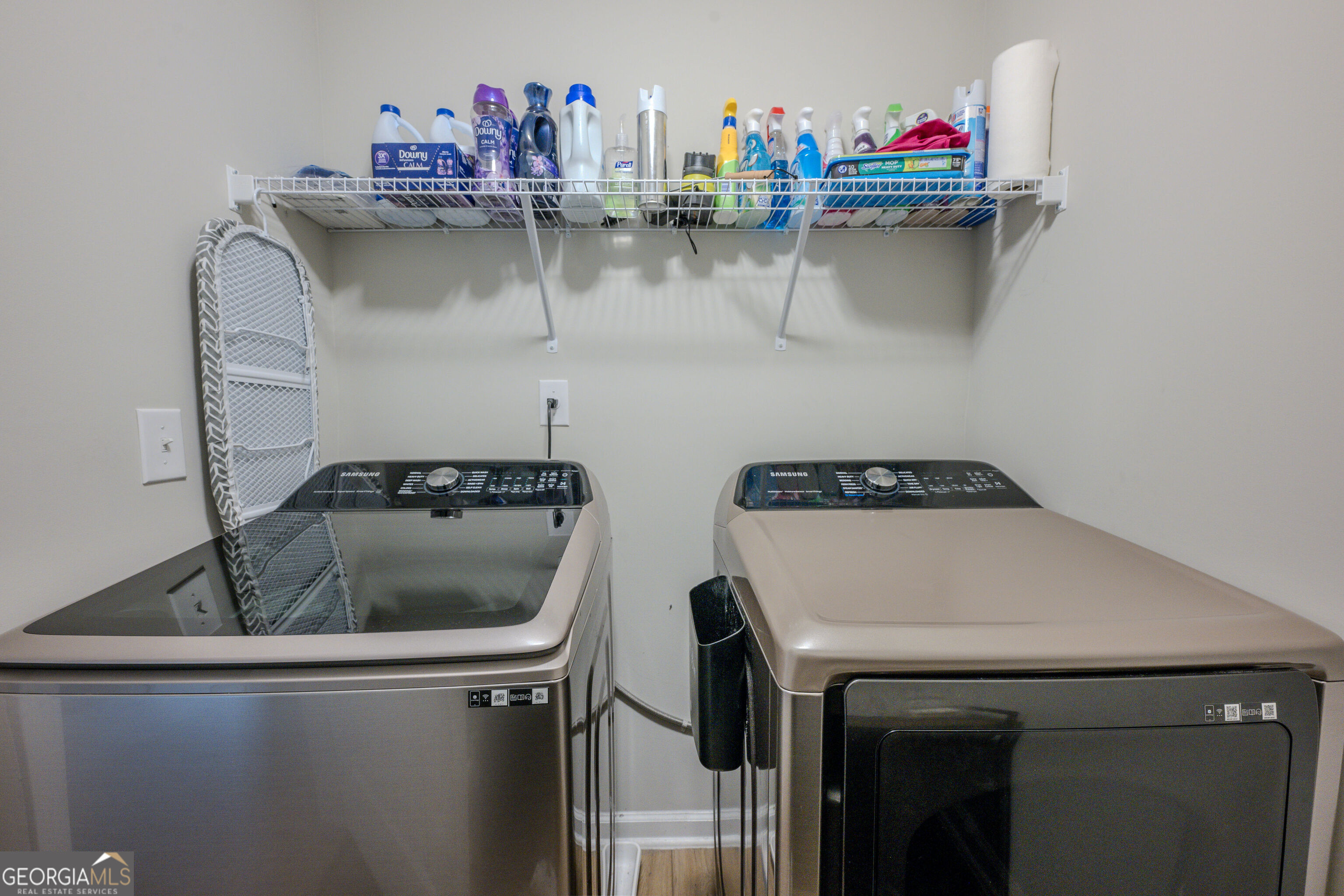 10155 Cormac Street Jonesboro, GA 30238 - Photo 34 of 40 a kitchen with a sink and a stove
