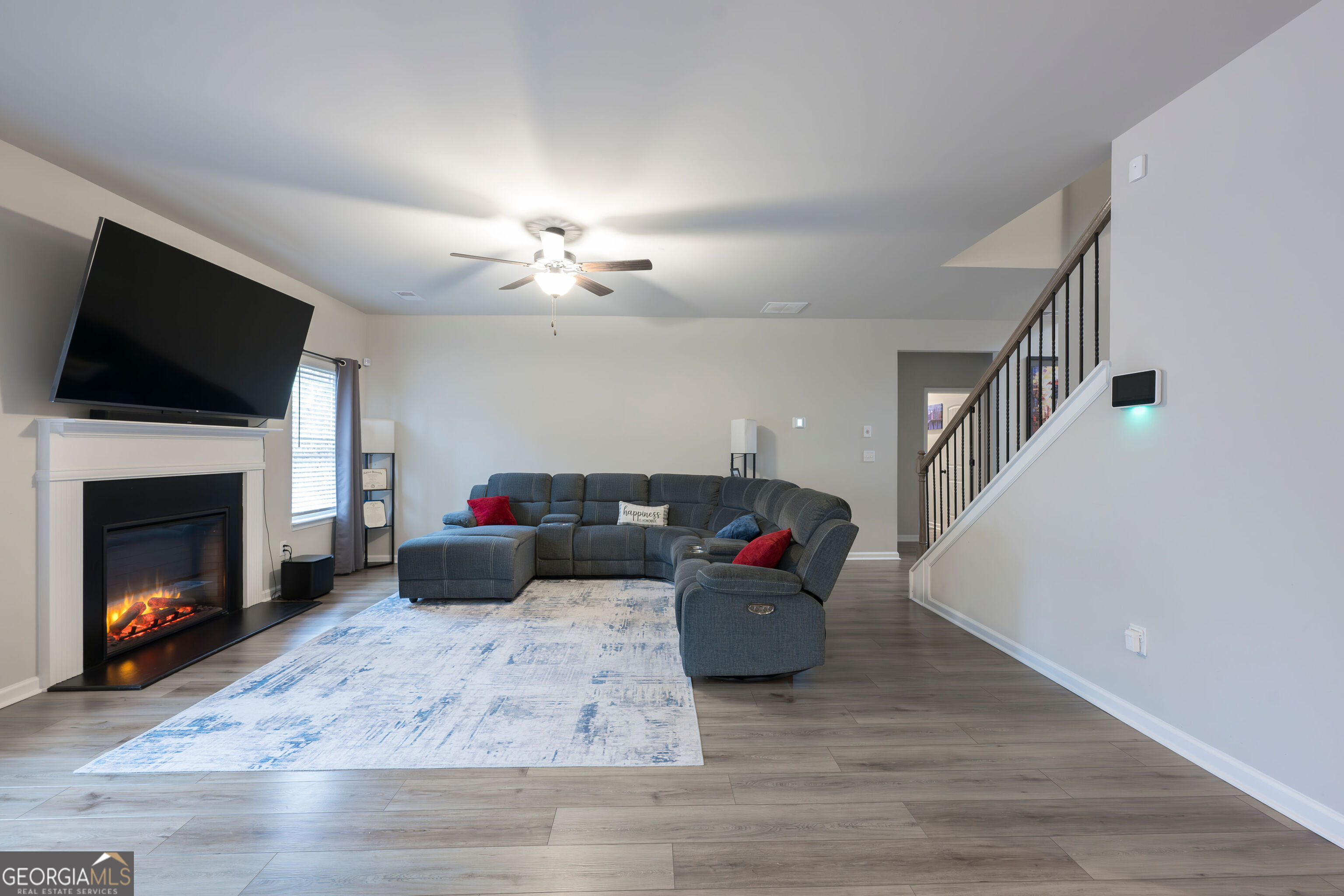 10155 Cormac Street Jonesboro, GA 30238 - Photo 6 of 40 a living room with furniture and a fireplace