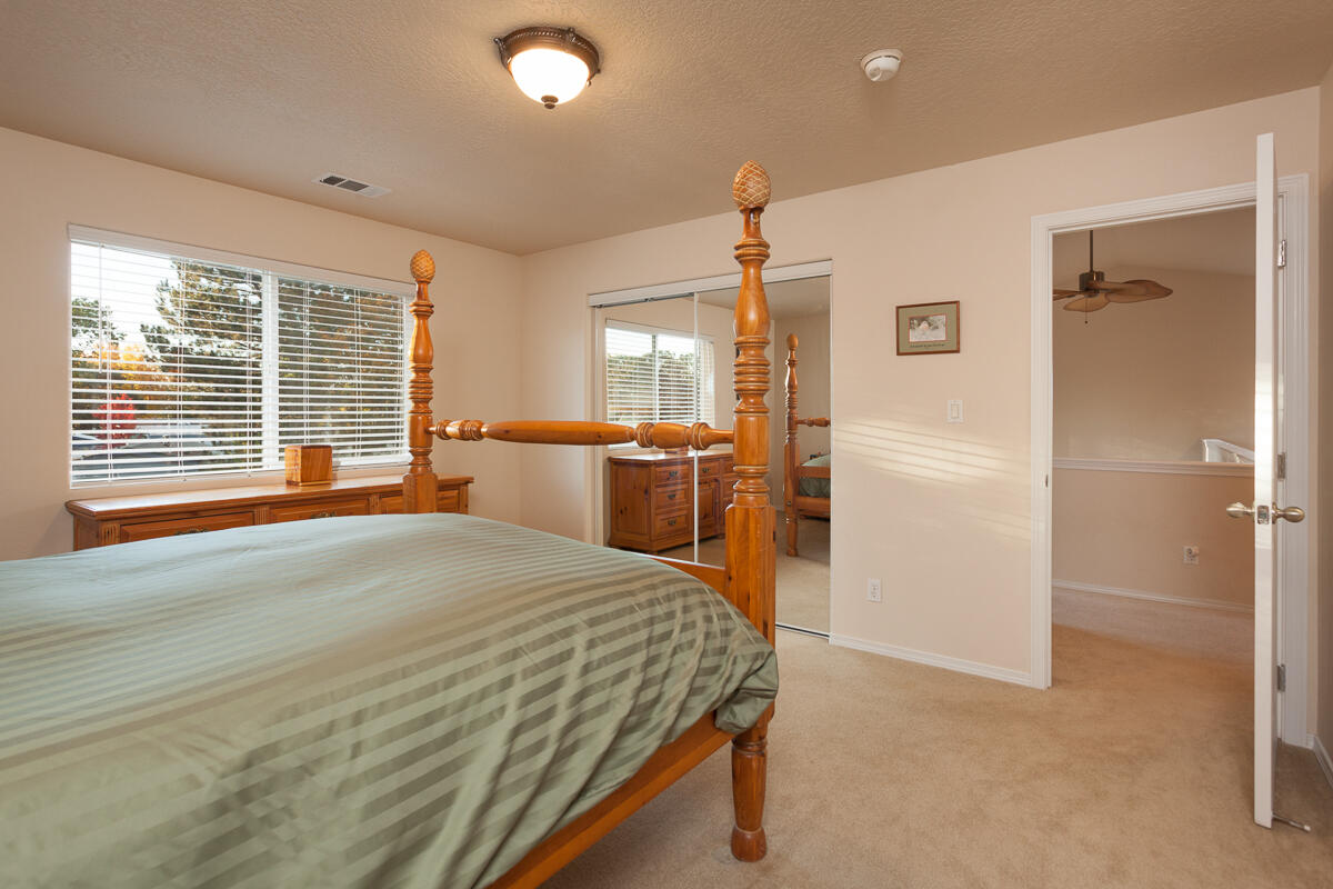 646 Raven Road Central Point, OR 97502 - Photo 51 of 74 a spacious bedroom with a bed and a large window