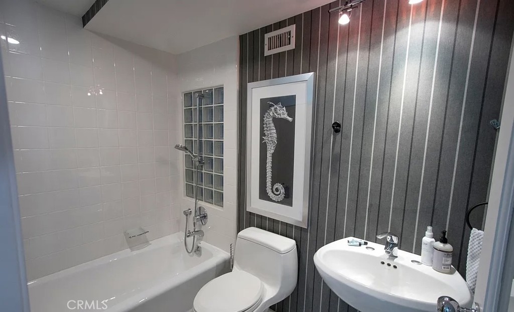 535 Ocean Santa Monica, CA 90402 - Photo 29 of 39 a bathroom with a sink and a mirror