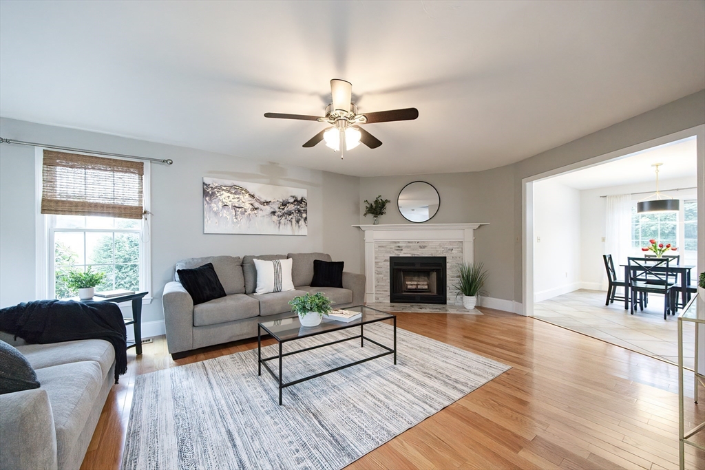 85 Sheldonville Road North Attleboro, MA 02760 - Photo 13 of 42 a living room with furniture a fireplace and wooden floor