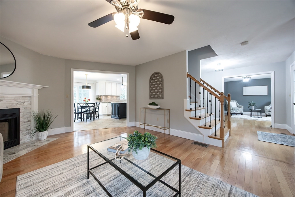 85 Sheldonville Road North Attleboro, MA 02760 - Photo 15 of 42 a living room with furniture a fireplace and a chandelier