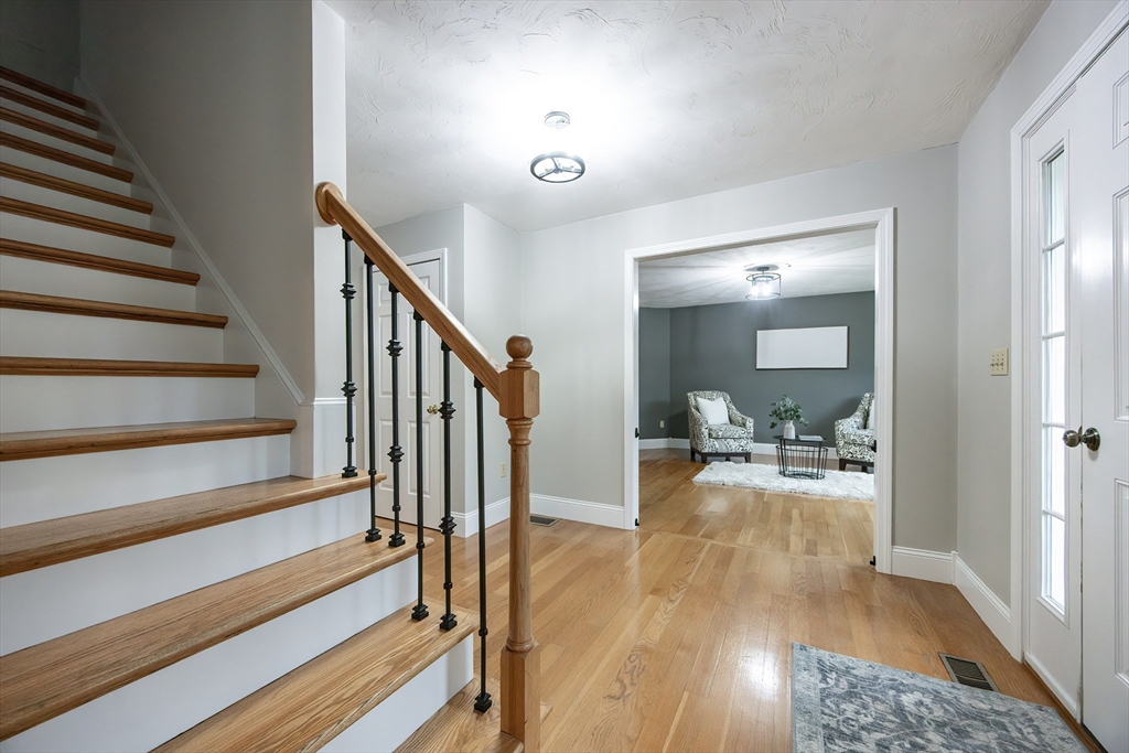 85 Sheldonville Road North Attleboro, MA 02760 - Photo 22 of 42 a view of a hallway view with wooden floor and dining room