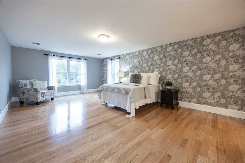 85 Sheldonville Road North Attleboro, MA 02760 - Photo 24 of 42 a spacious bedroom with a bed and wooden floor