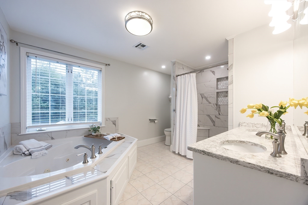 85 Sheldonville Road North Attleboro, MA 02760 - Photo 26 of 42 a bathroom with a tub sink and mirror