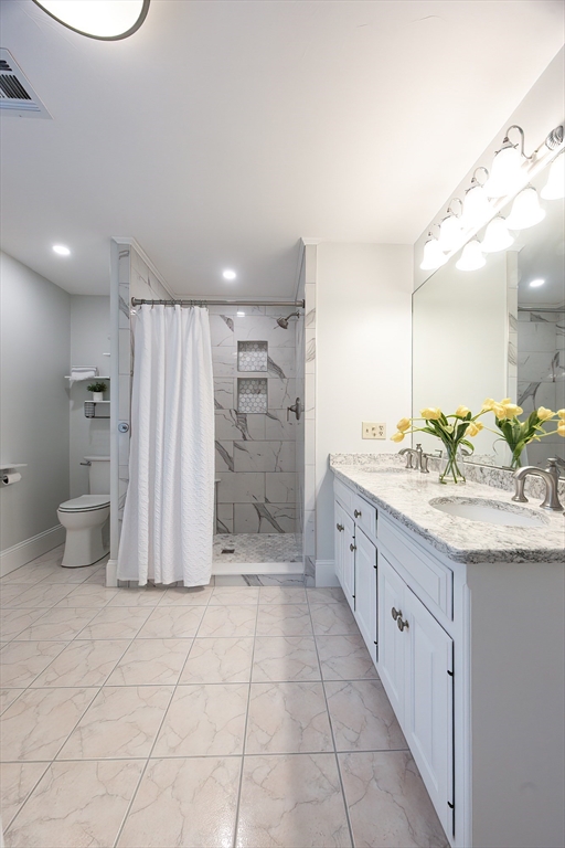 85 Sheldonville Road North Attleboro, MA 02760 - Photo 27 of 42 a bathroom with a granite countertop sink a toilet and shower