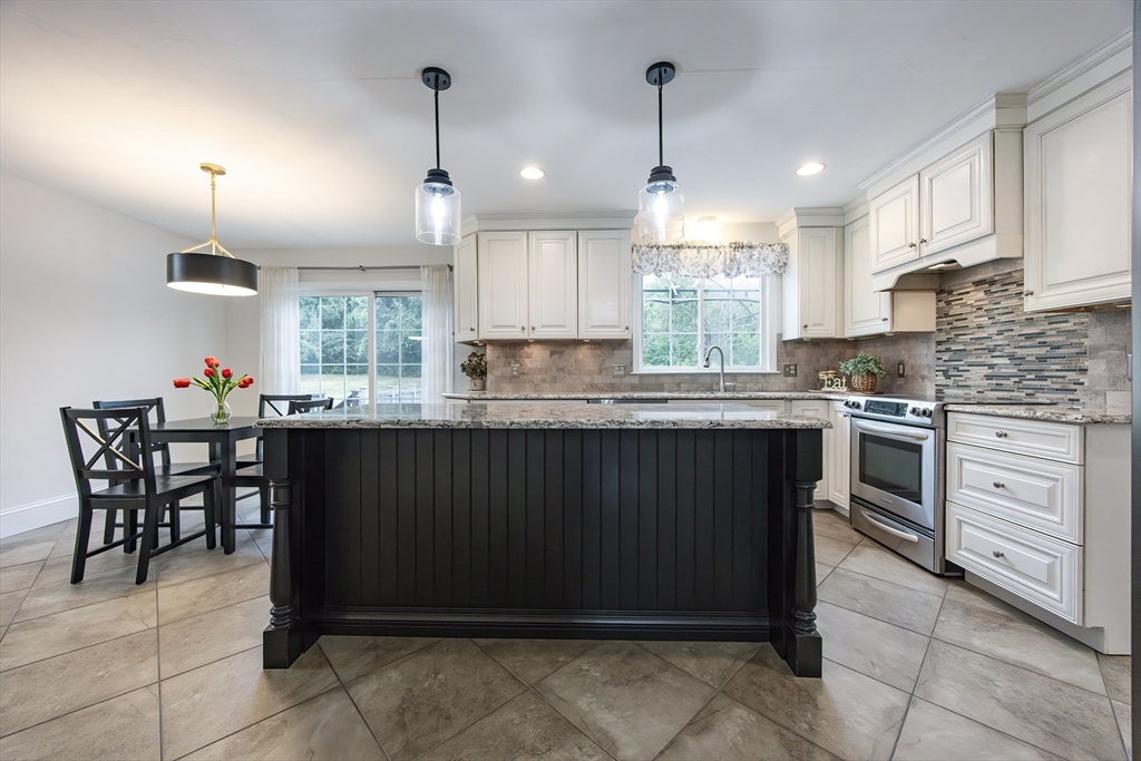 85 Sheldonville Road North Attleboro, MA 02760 - Photo 3 of 42 a kitchen with stainless steel appliances granite countertop a stove a sink a oven a counter space and cabinets