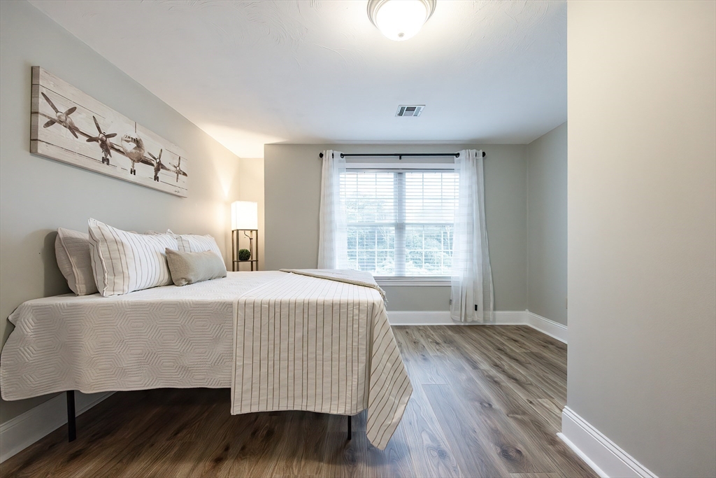 85 Sheldonville Road North Attleboro, MA 02760 - Photo 31 of 42 a spacious bedroom with a bed and wooden floor