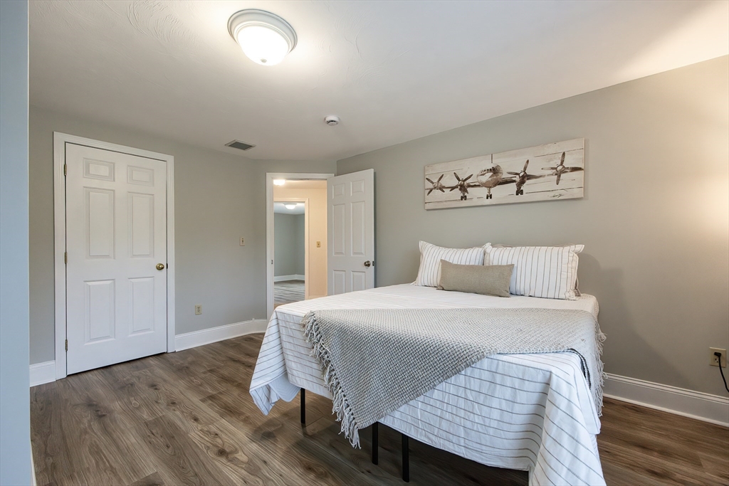 85 Sheldonville Road North Attleboro, MA 02760 - Photo 32 of 42 a bedroom with a bed and wooden floor