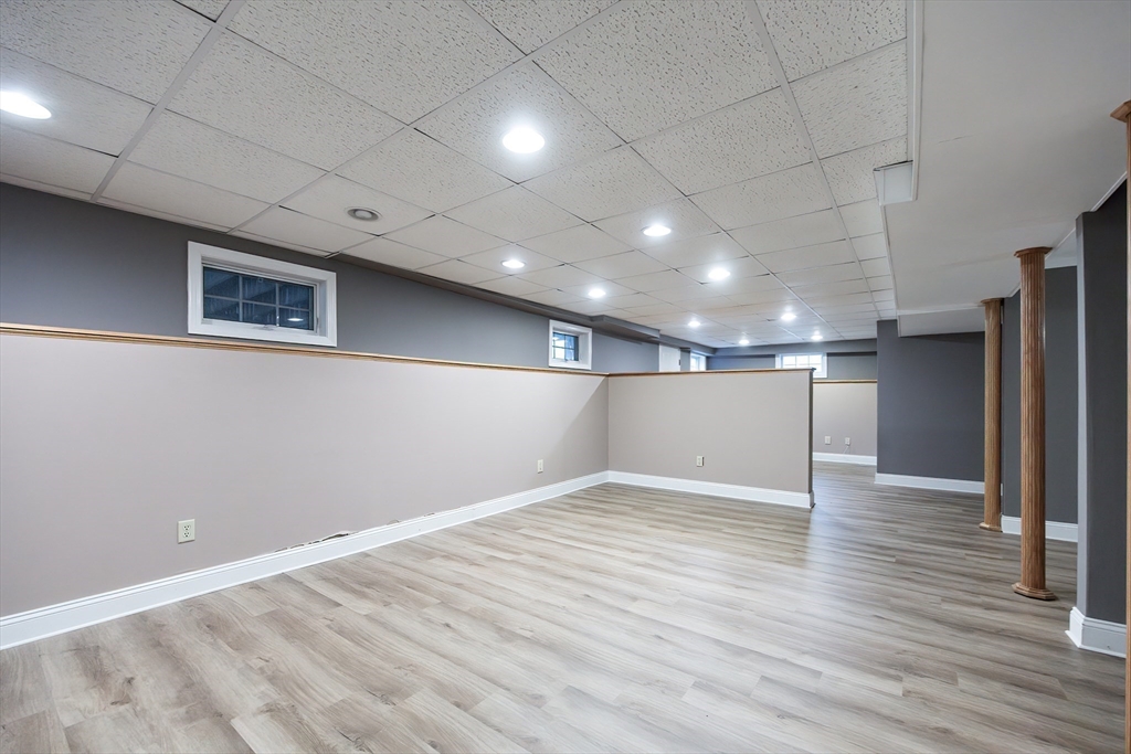 85 Sheldonville Road North Attleboro, MA 02760 - Photo 36 of 42 an empty room with wooden floor and a refrigerator