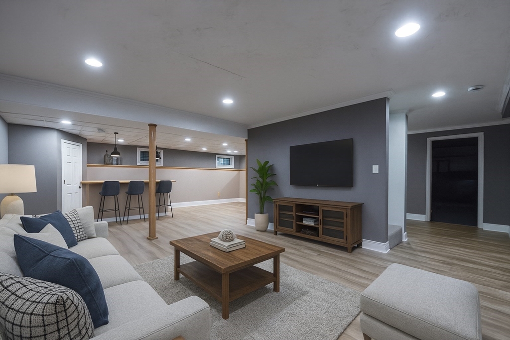 85 Sheldonville Road North Attleboro, MA 02760 - Photo 37 of 42 a living room with furniture a flat screen tv and a fireplace