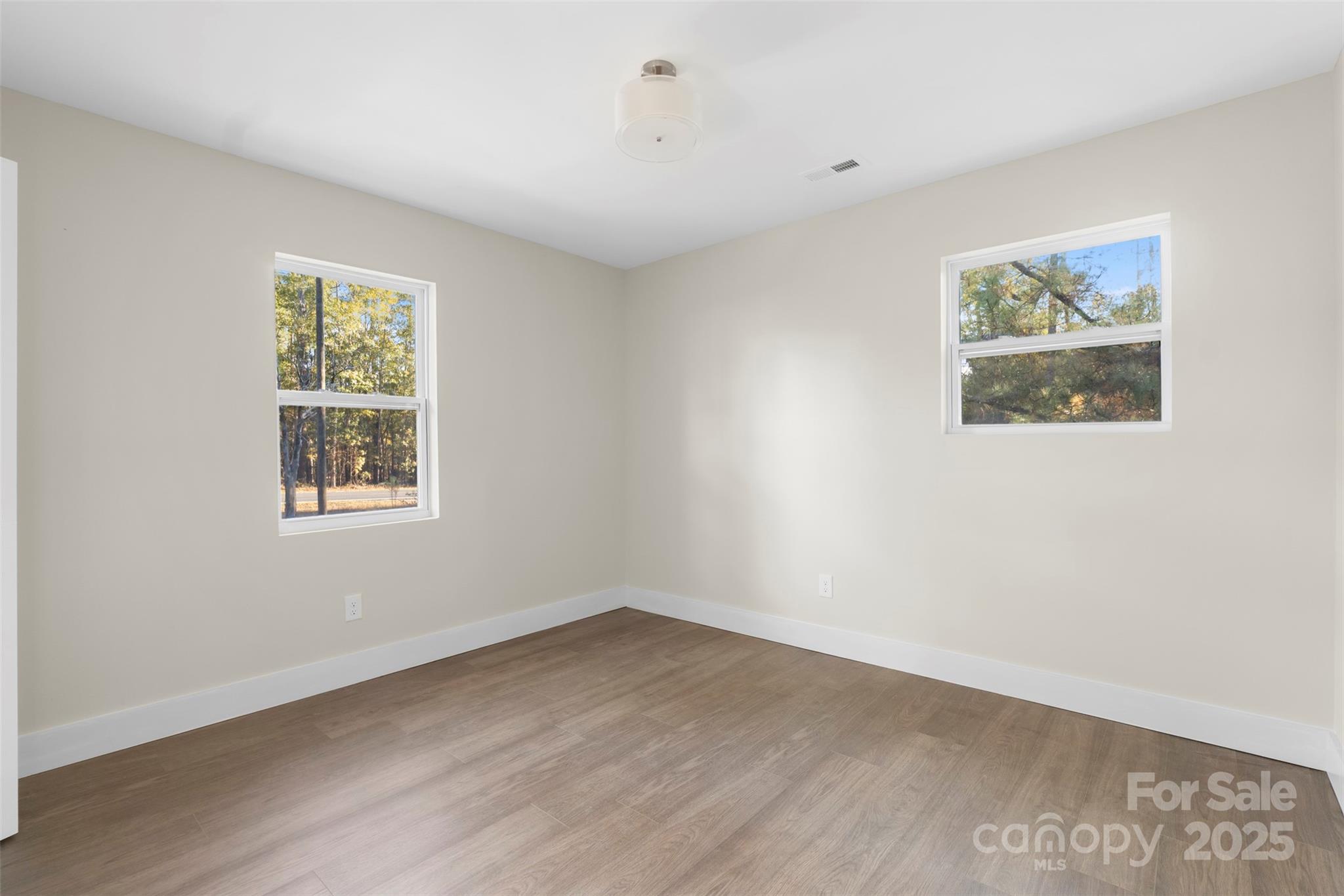 15861 Palmer Road Marston, NC 28363 - Photo 15 of 28 a view of an empty room with a window and wooden floor