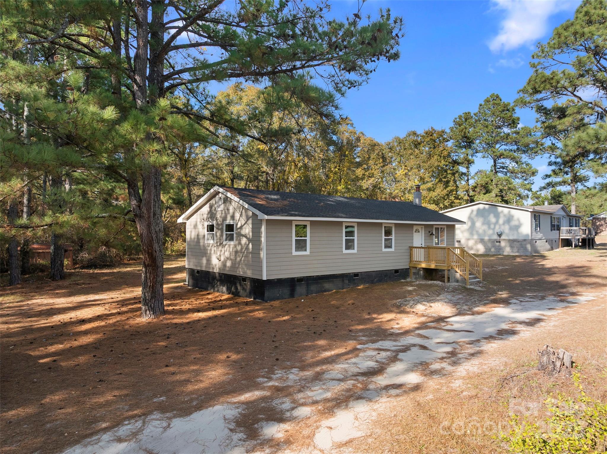 15861 Palmer Road Marston, NC 28363 - Photo 2 of 28 a front view of a house with garden