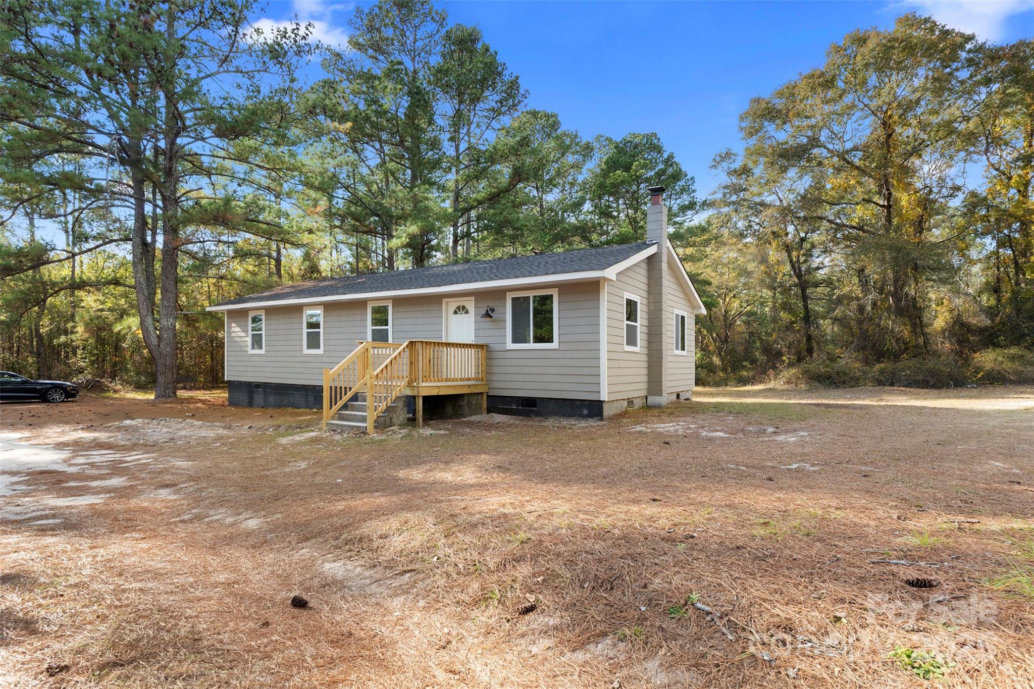 15861 Palmer Road Marston, NC 28363 - Photo 3 of 28 a view of a house with a yard and sitting area