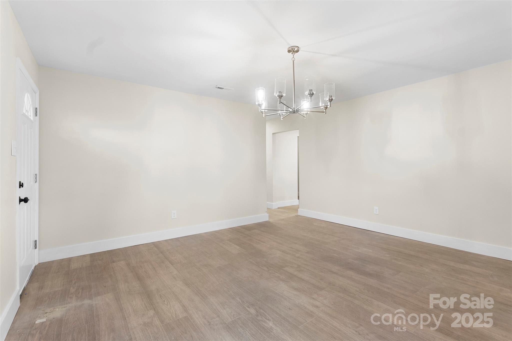 15861 Palmer Road Marston, NC 28363 - Photo 6 of 28 a view of an empty room with wooden floor