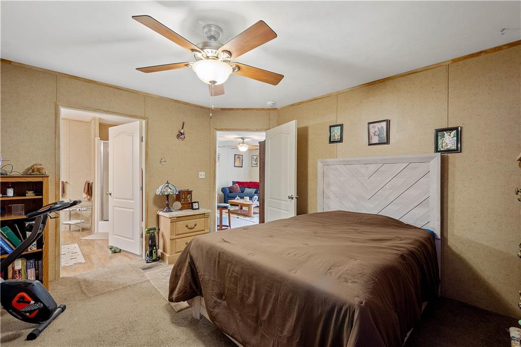 534 Finks Run Road McDonald, PA 15057 - Photo 23 of 35 a bedroom with a bed and a chandelier