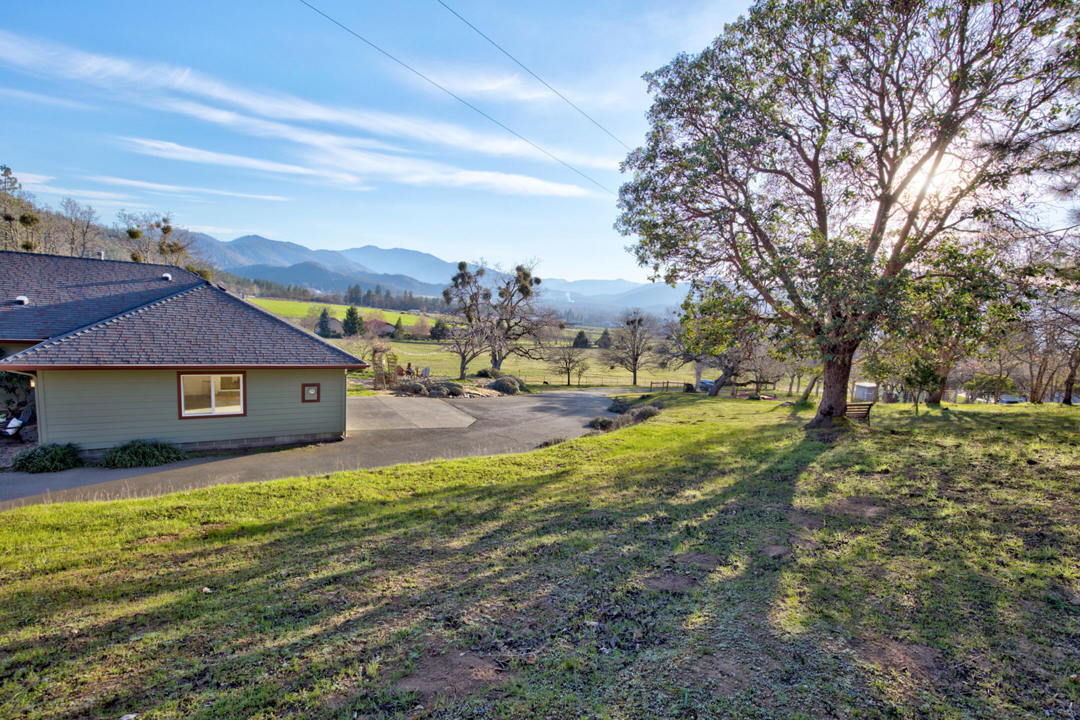 1440 Kubli Road Grants Pass, OR 97527 - Photo 43 of 56 a view of a yard with an house and trees