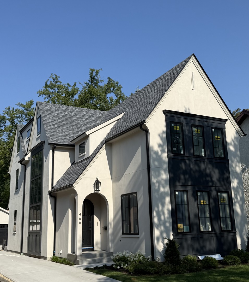a front view of a house with garage