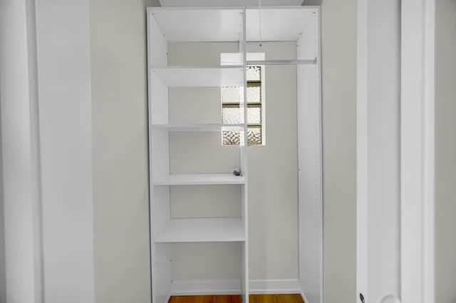 a bathroom with a sink mirror toilet and bathtub