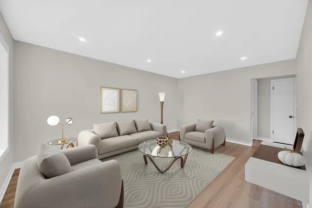 a living room with furniture or couch and a wooden floor