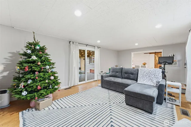 a living room with furniture plant and a potted plant