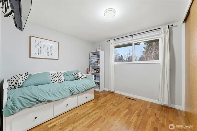 a living room with couch and a window