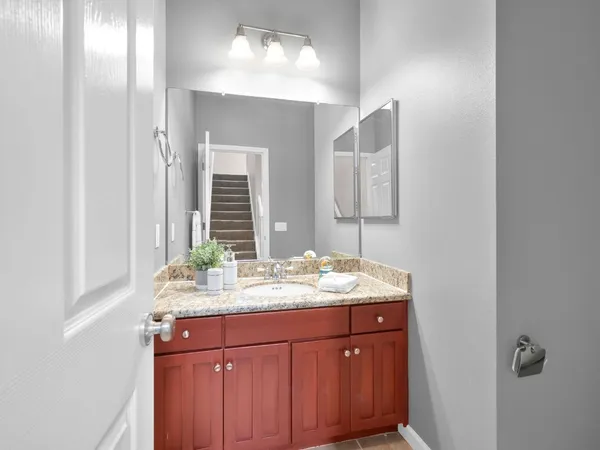 a bathroom with a sink and a mirror