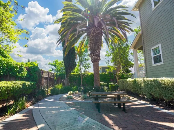 an aerial view of multiple houses with a yard