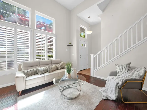 a living room with furniture and a large window