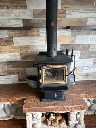 a stove top oven sitting inside of a kitchen