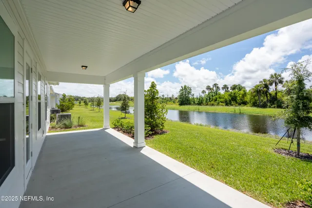 a kitchen with kitchen island a sink stainless steel appliances and cabinets
