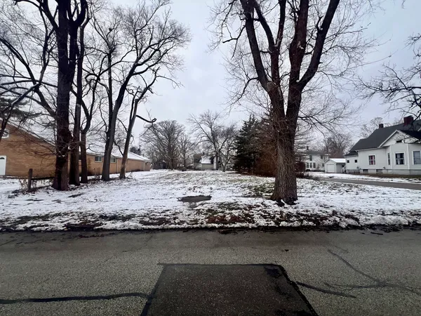 a view of a yard covered with snow