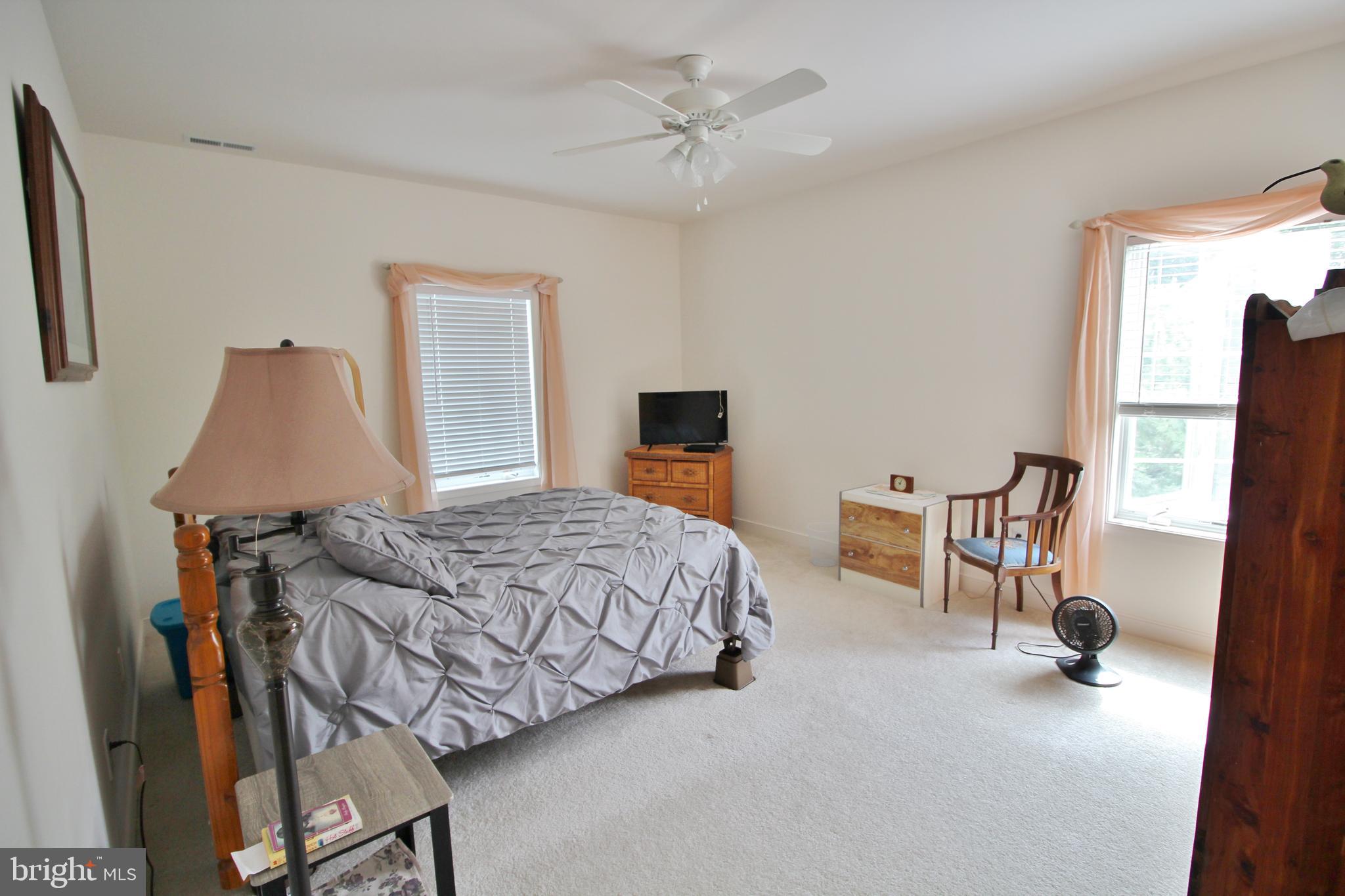 30619 Cedar Neck Road, Unit 1201 Ocean View, DE 19970 - Photo 14 of 30 Owner's Bedroom looks out on to trees