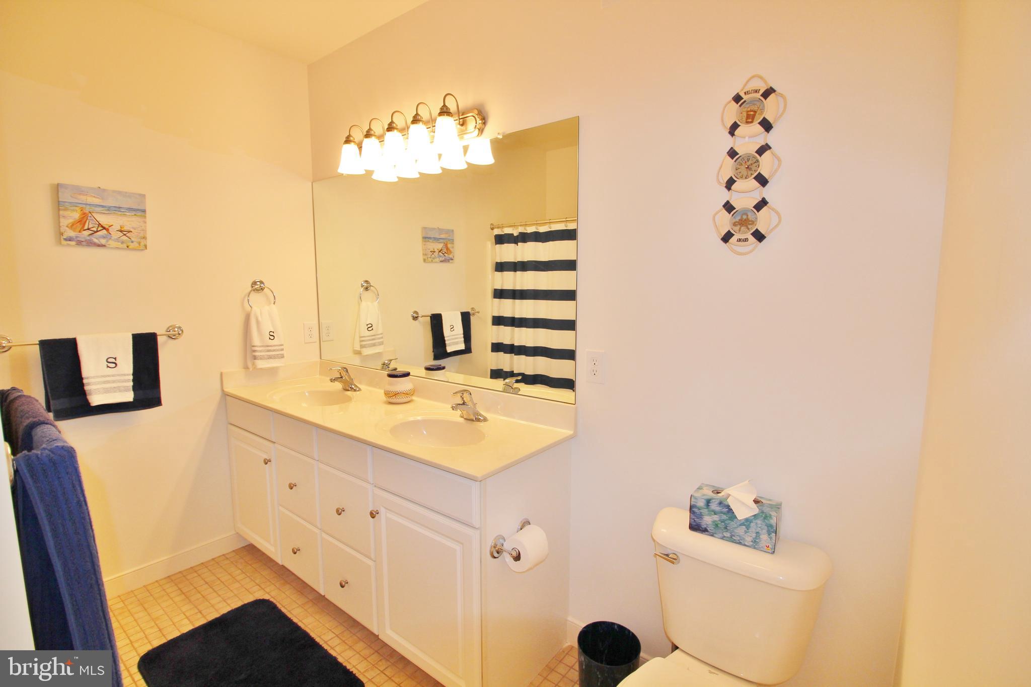 30619 Cedar Neck Road, Unit 1201 Ocean View, DE 19970 - Photo 17 of 30 Owner's Bath features a dual vanity