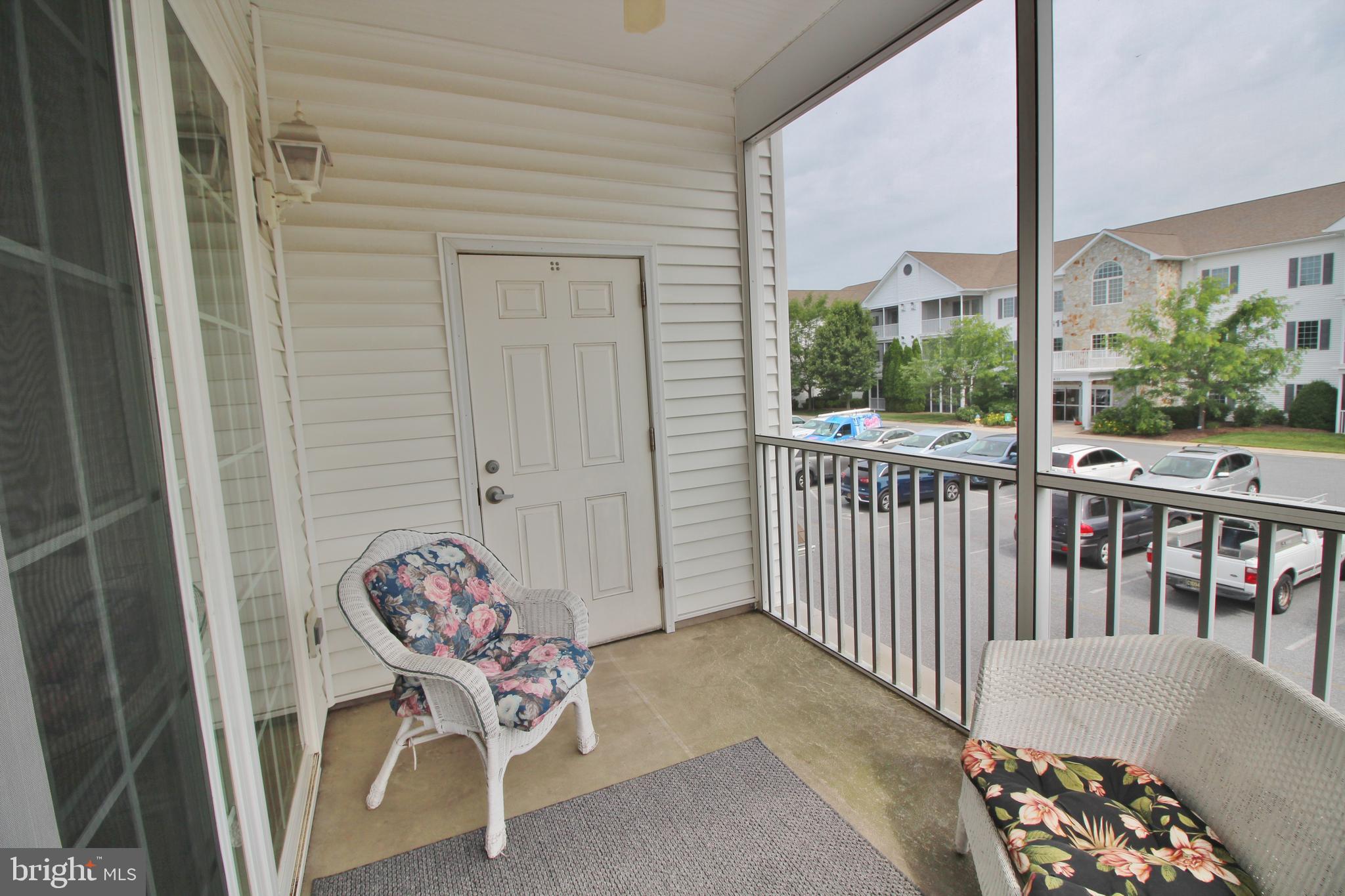 30619 Cedar Neck Road, Unit 1201 Ocean View, DE 19970 - Photo 26 of 30 Screened Porch and storage closet