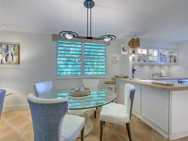 a spacious bedroom with a bed and a flat screen tv